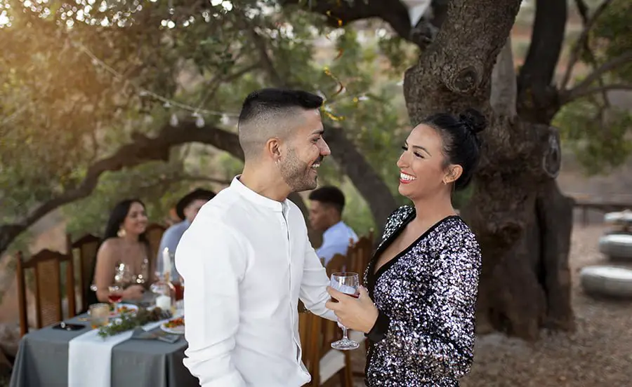 guy attends outdoor wedding