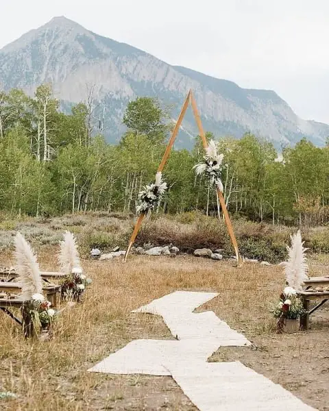 Scenic And Serene: Delicate Florals Pair With Rocky Mountain Backdrop For A Spectacular Natural Wedding Decor natural outdoor wedding decoration