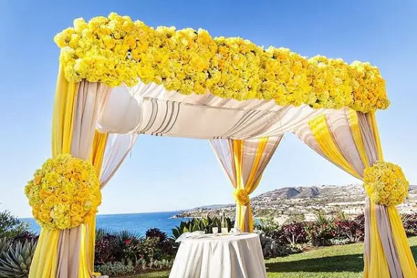 Sun-kissed Blue And Yellow Outdoor Wedding Decor Perfect For Persian And Jewish Traditions yellow outdoor wedding decor