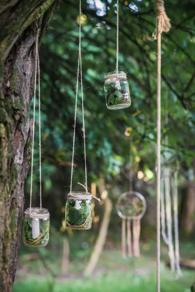 Mason Jar Candles in trees wedding decor