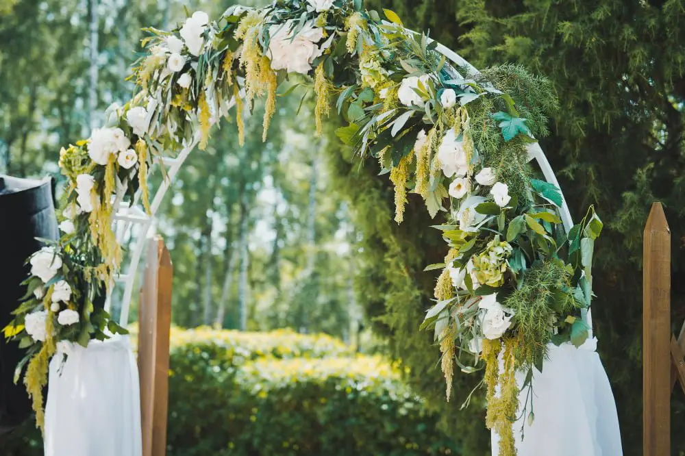 outside wedding floral entrance