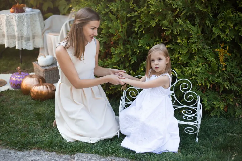 child seating at outdoor wedding