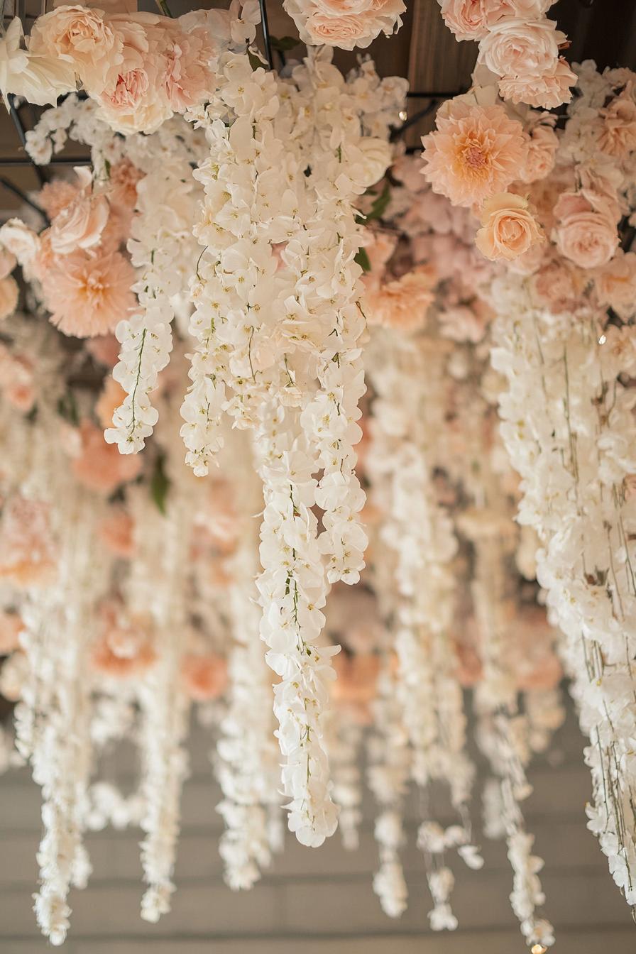 Hanging floral arrangement with white and pink flowers