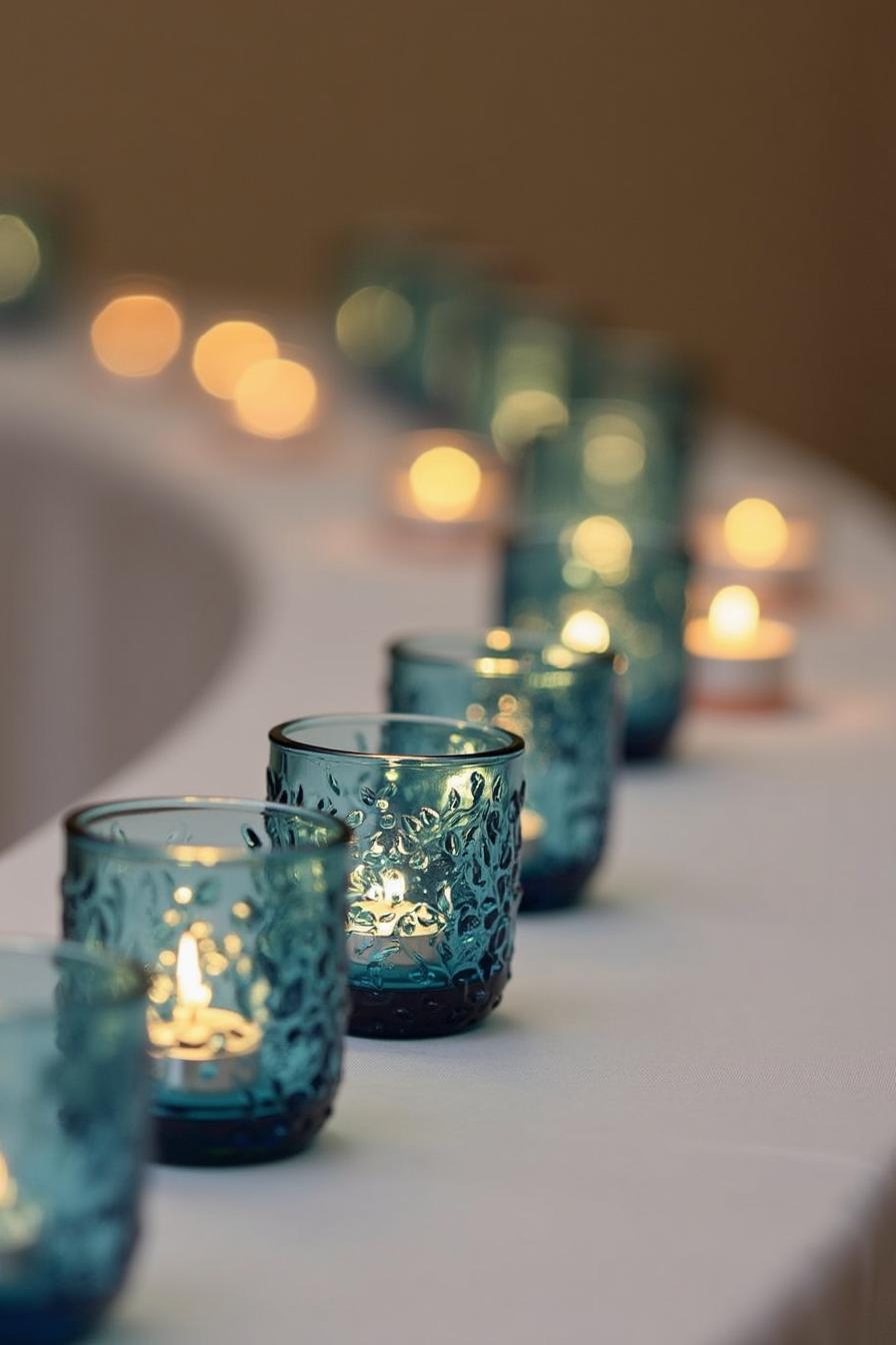 Blue candle holders line a wedding aisle, casting a warm and intimate glow