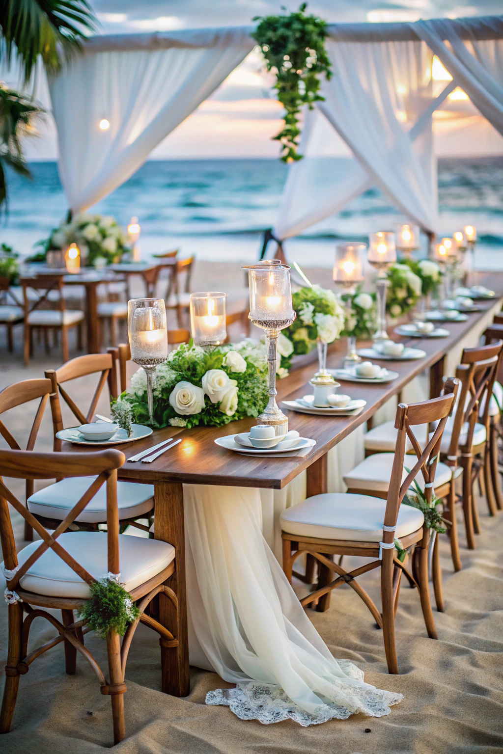 Beachfront wedding decor with elegant table setup and glowing candles